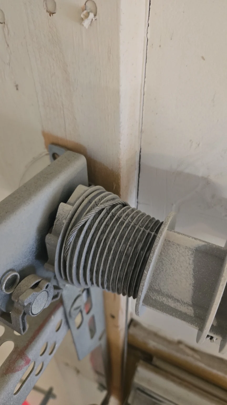 Wayne Dalton garage door cable off the drum in Houston, TX