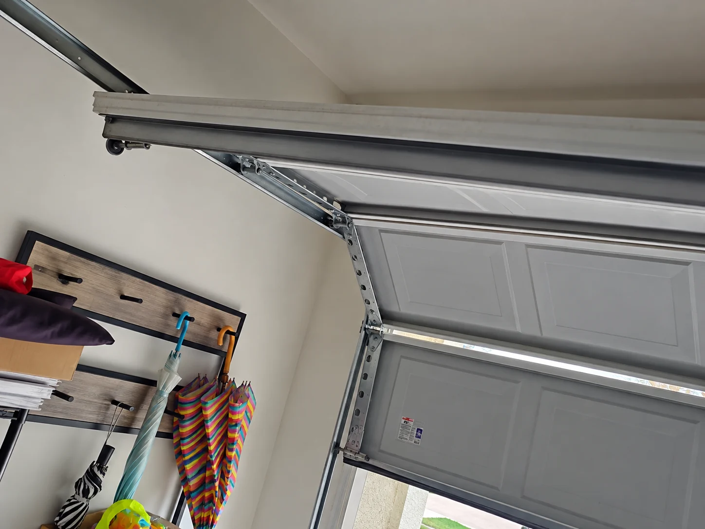 Garage door off track after cable failure in Houston, TX