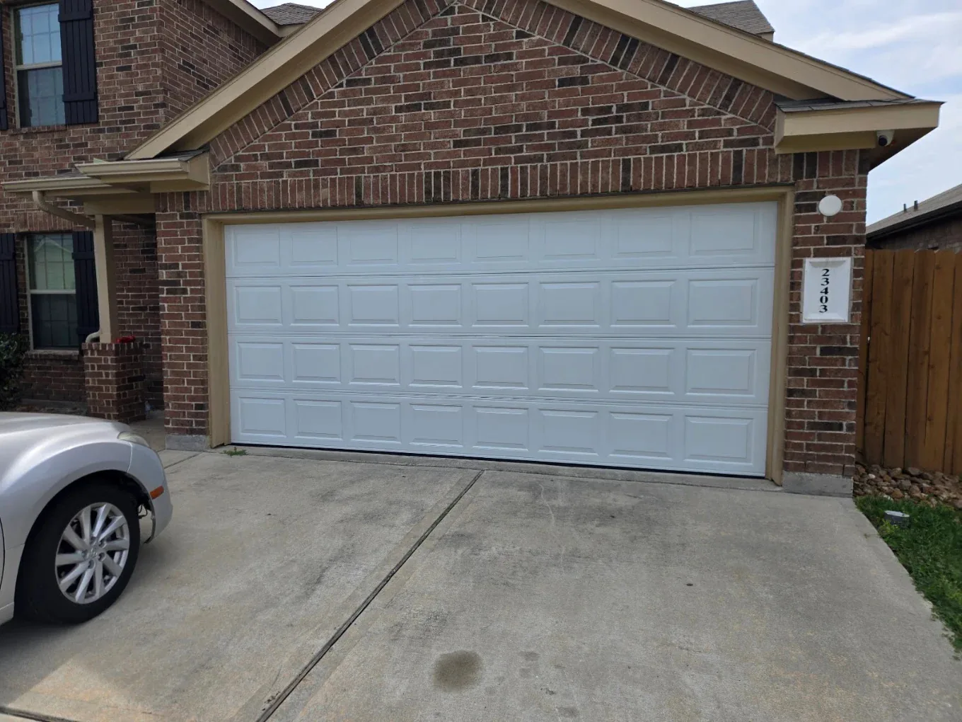 Completed residential garage door installation in Houston TX by Non Stop Garage Door