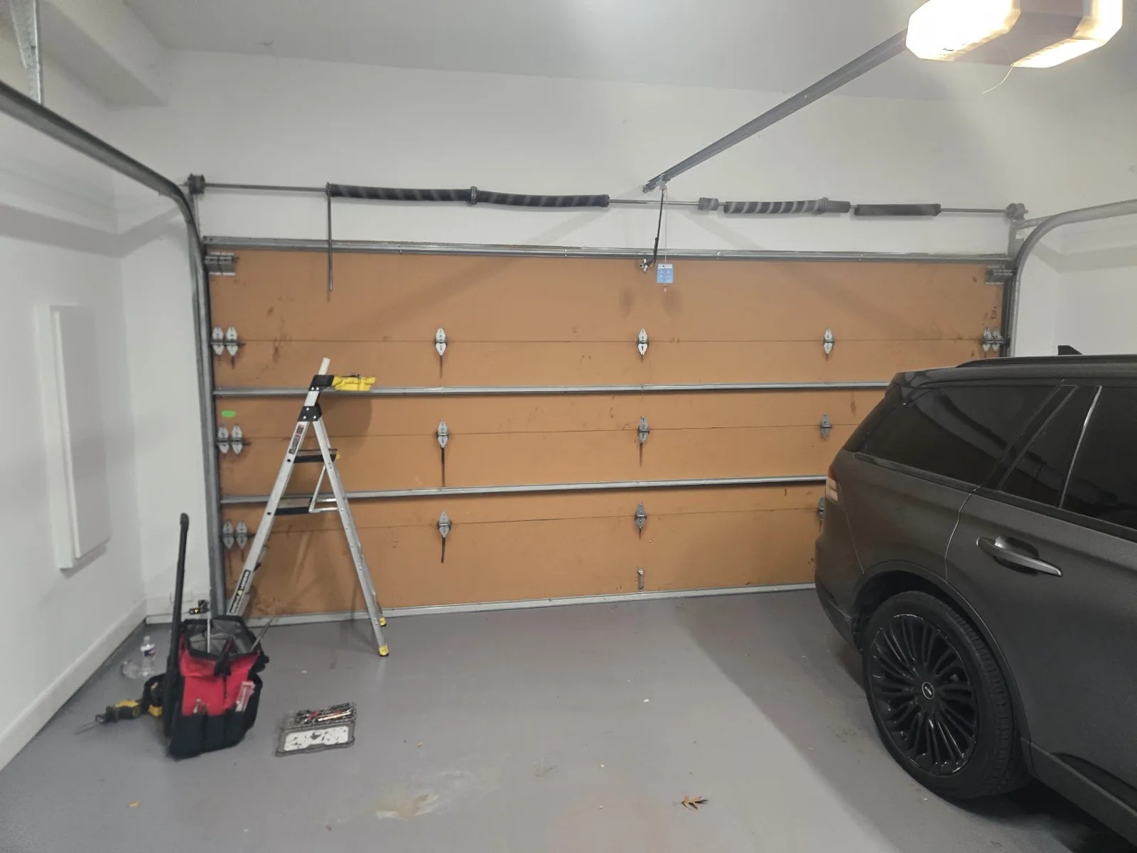 Four torsion springs before replacement in Houston TX by Non Stop Garage Door