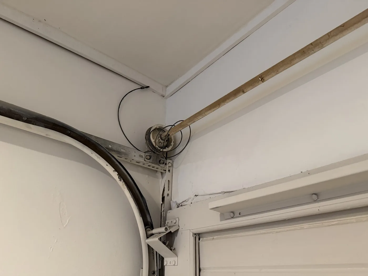 Garage door cable off the drum during cable repair inspection in Houston TX