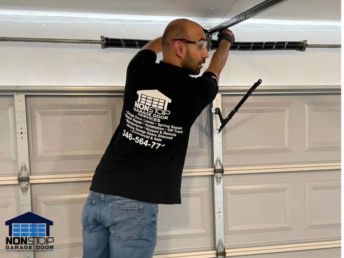 Garage door spring repair technician in Houston TX by Non Stop Garage Door