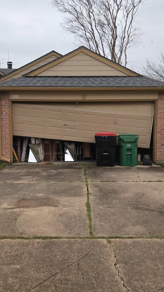 Off track garage door repair in Houston TX by Non Stop Garage Door