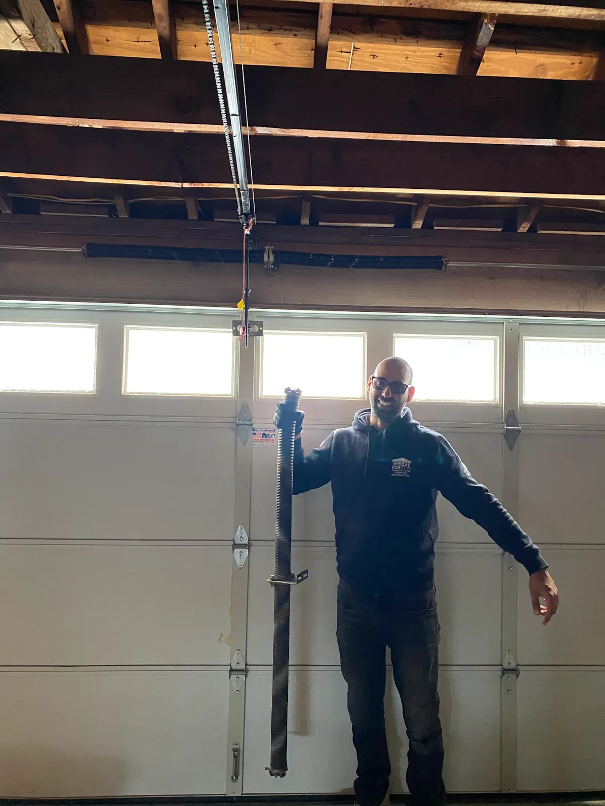 Two torsion spring replacement with new torsion tube in Houston TX by Non Stop Garage Door