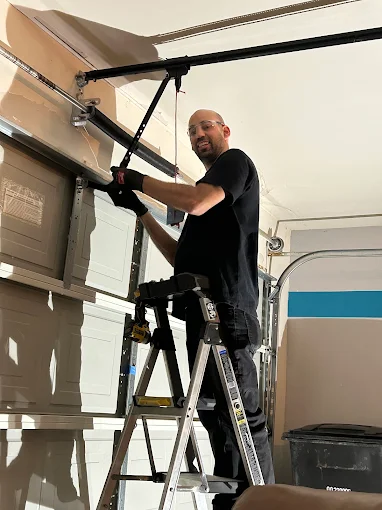 Non Stop Garage Door technician performing garage door repair