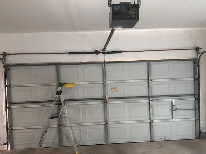 Garage door repair South Houston TX broken torsion spring service